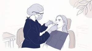 A dentist examines a seated patient during a preventive dental check-up, with clinic equipment nearby.